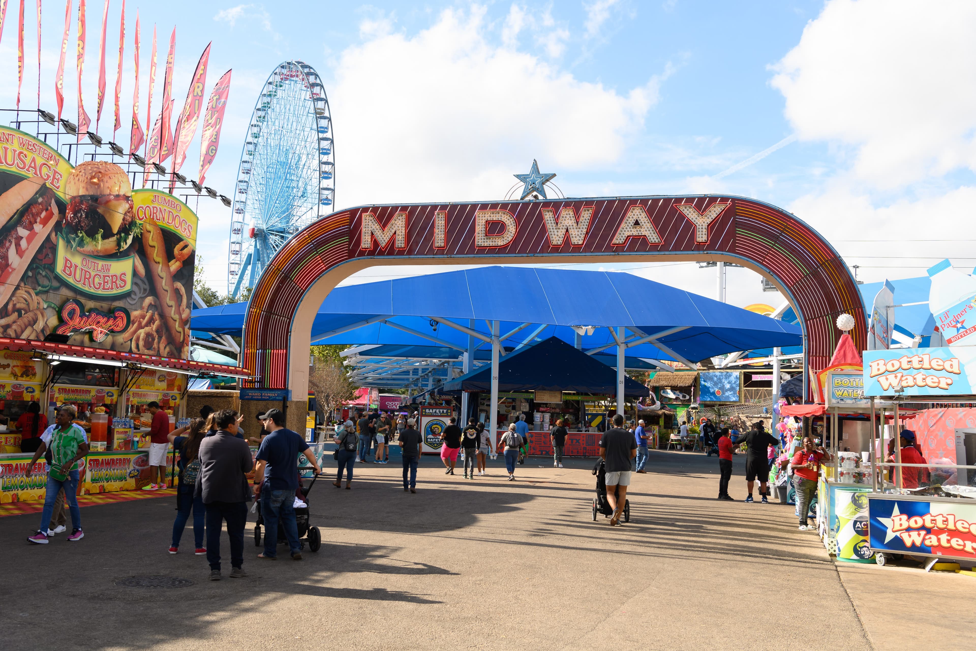 File photo: The Midway entrance frames games and rides in daylight.